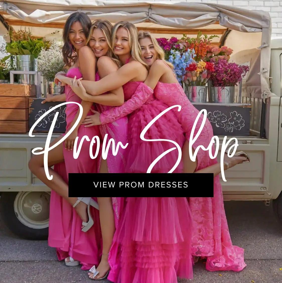 Model wearing a dark pink prom dress