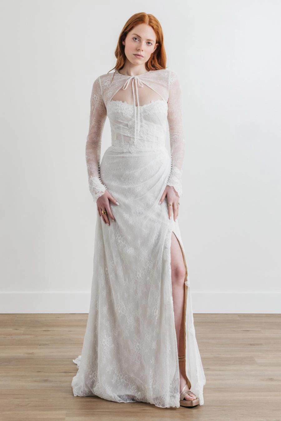 Model wearing a white Willowby Gown